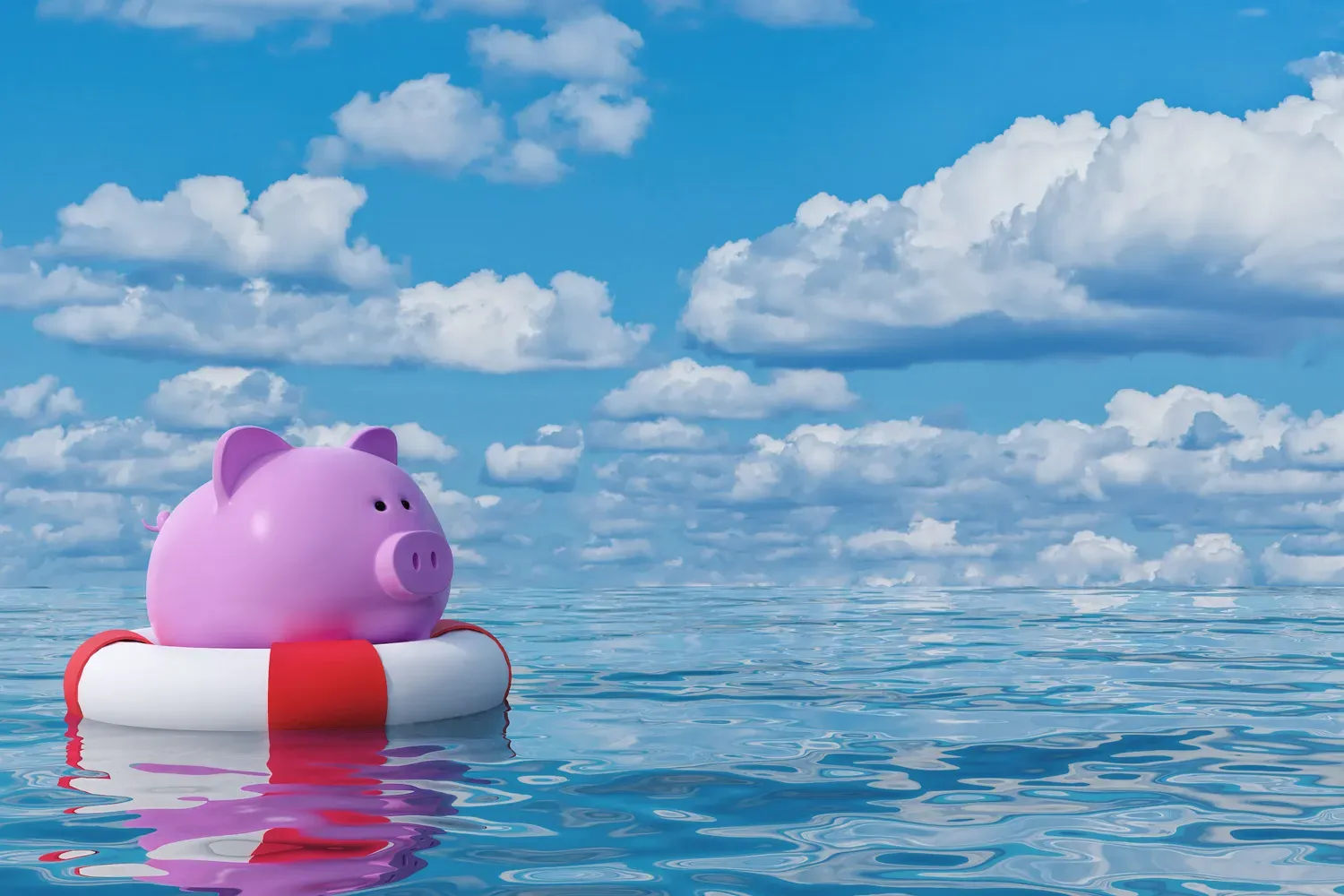 Pink piggy bank floating on a life preserver in calm water under a blue sky with clouds, symbolizing the importance of emergency savings for financial security.