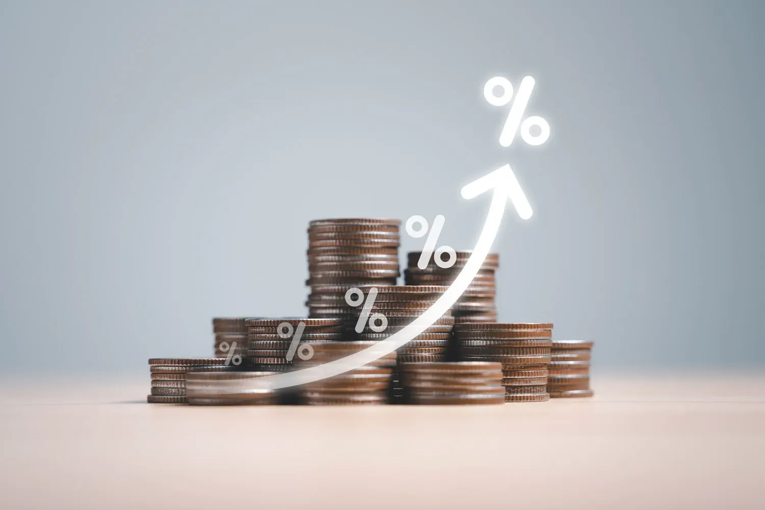 Stacks of coins arranged in ascending order with glowing percentage symbols and an upward arrow, representing the concept of simple interest and financial growth over time.
